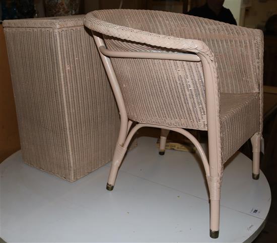 A pink painted Lloyd Loom armchair and linen box